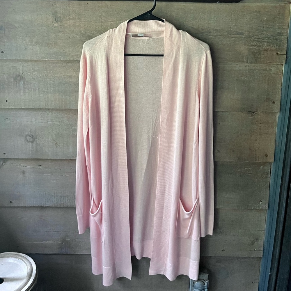 This sweater is so versatile. The color is faint, ballet pink, very beautiful.